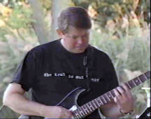 Doug Drilling plays guitar